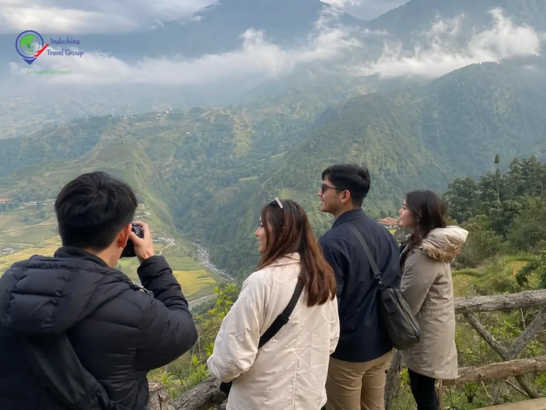 Filipino travelers taking photos in the mountains of Sapa Vietnam