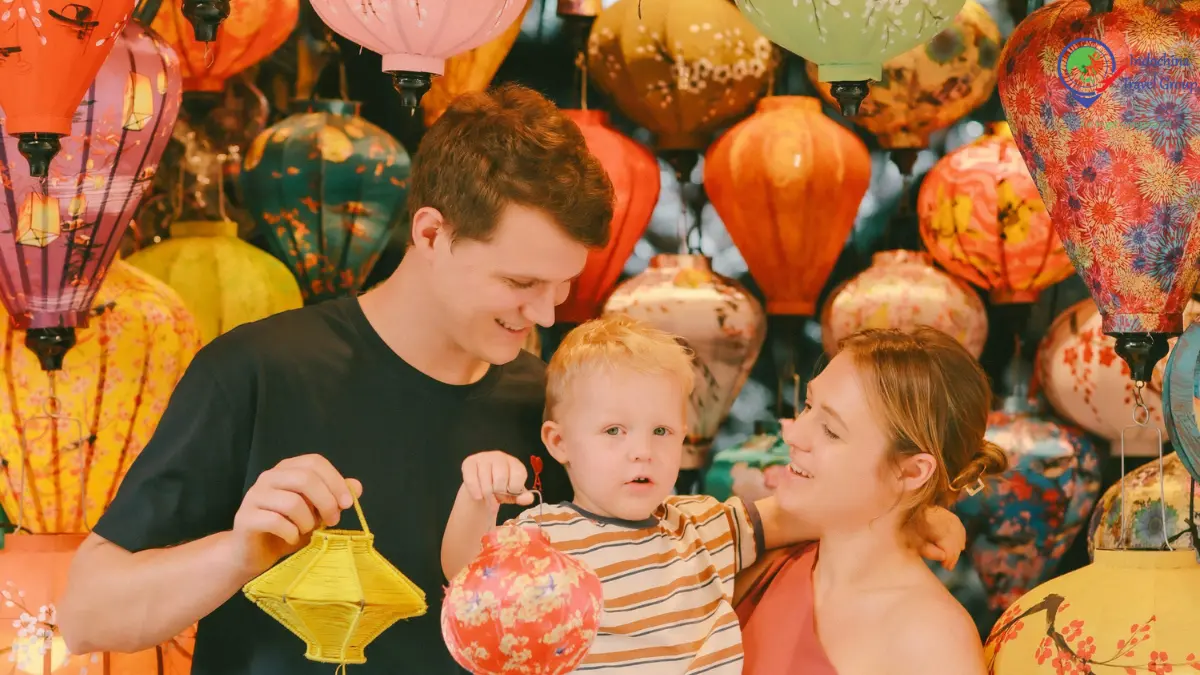 Family exploring colorful lanterns during an evening in Hoi An Vietnam