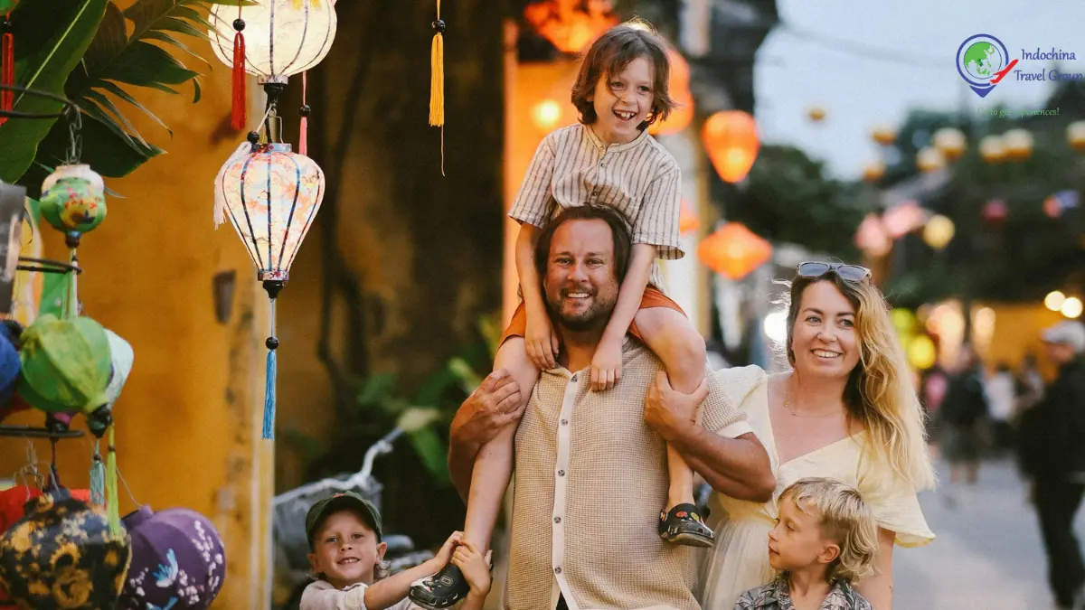 Family enjoying a relaxed visit among lanterns in Hoi An Vietnam